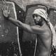 Portrait of a sexy handsome bearded man with bare torso wearing bandan... (thumbnail)