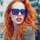 Retro fashion portrait of a young red-haired lady in funky avant-garde... (thumbnail)