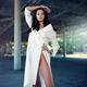 Beautiful exotic girl posing in an empty parking lot in a white dress... (thumbnail)
