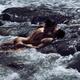 Sensual romantic nude couple in an embrace, kissing, making love in wi... (thumbnail)
