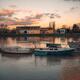 Boats in sunset scenery at Tournus town on the Saône River in France... (thumbnail)