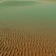 Intricate wave patterns on the sea beach sand in low tide at sunrise... (thumbnail)