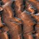 Closeup of a wave patterns background in the sea sand at low tide at s... (thumbnail)