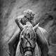 Black and white portrait of a beautiful young woman sitting naked on a... (thumbnail)