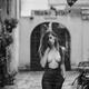 Woman walking topless on the street in suspender pants revealing her b... (thumbnail)