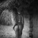 Young woman standing half naked by a rural house in countryside reveal... (thumbnail)