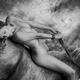 Nude woman lying on a horse back in nature scenery Black and white ero... (thumbnail)