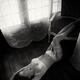 Sexy woman in white lingerie and stockings lying on the floor of a hou... (thumbnail)