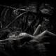 Black and white Fine art nude portrait of a beautiful nude woman lying... (thumbnail)