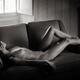 Beautiful nude young woman lying naked on a couch Black and white... (thumbnail)
