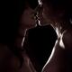 Two women kissing sensual close up of a female lesbian couple faces on... (thumbnail)