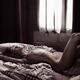 Sexy young woman lying naked relaxed on a bed in soft daylight from a... (thumbnail)
