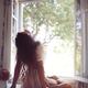 Romantic sensual couple making love in front of an open window in coun... (thumbnail)