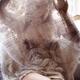 Sexy young woman undressing looking through sheer white lace nightgown... (thumbnail)