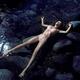 Beautiful woman in pink lingerie lying relaxed half-naked in calm clea... (thumbnail)