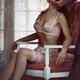 Sensual couple artistic boudoir. Woman in lingerie sitting blindfolded... (thumbnail)