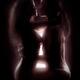 Beautiful sensual couple in an embrace with light glowing between thei... (thumbnail)