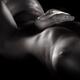 Albino boa snake glistening on a sexy nude body of a woman with skin s... (thumbnail)
