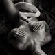 Large white boa snake coiling up a beautiful nude body of a woman with... (thumbnail)
