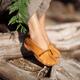 Closeup of woman feet in deer hide deerskin leather moccasins in the n... (thumbnail)