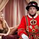 Humorous couple portrait of a Beefeater, Royal bodyguard and a beautif... (thumbnail)