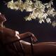 Sensual nude portrait of a beautiful naked woman reclining relaxed in... (thumbnail)