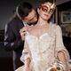 Sensual portrait of a couple, man kissing beautiful woman in carnival... (thumbnail)