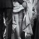 Man raising up woman's dress skirt revealing her sexy legs in sto... (thumbnail)