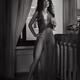 Beautiful sexy woman in sheer unbuttoned dress revealing her naked bod... (thumbnail)
