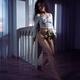 Beautiful young woman dancing half-naked with a rose in dark room... (thumbnail)