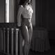 Black and white art nude portrait of a beautiful woman standing half-n... (thumbnail)