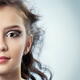 Teenage girl half face with artistic eye-shadow makeup... (thumbnail)