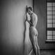 Expressive art nude portrait of a woman with short hair standing naked... (thumbnail)