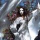 Mysterious woman in spirit-like face mask and white gown dancing grace... (thumbnail)