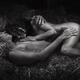 Beautiful nude couple, man and woman, lying relaxed naked sleeping in... (thumbnail)