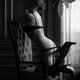 Black and white boudoir portrait of sexy woman in underwear posing in... (thumbnail)