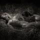 Sexy couple man and woman making love lying naked on straw in dark sha... (thumbnail)