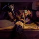 Sexy love threesome of a seductive woman in black underwear and a mask... (thumbnail)
