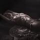 Beautiful nude woman with a rose lying tied up on the floor with red S... (thumbnail)