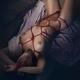 Beautiful nude woman lying on tatami mats tied up with red Shibari bon... (thumbnail)