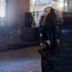 Woman in sexy stylish black clothes smoking a cigarette on night city... (thumbnail)
