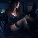 Gorgeous woman in a black leather coat, sexy lingerie and stockings at... (thumbnail)