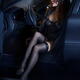 Beautiful sexy woman in black lingerie and stockings getting out of a... (thumbnail)