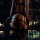 Sexy woman in lingerie undressing in front of a condo window at night... (thumbnail)