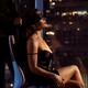 Man tying blindfold over elegant sexy woman's eyes sitting in cha... (thumbnail)