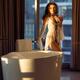 Beautiful sexy woman in white lace night gown standing by a bath tub i... (thumbnail)