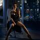 Beautiful sexy woman with glass of wine sitting in chair in provocativ... (thumbnail)