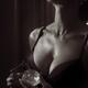 Sensual black and white beauty portrait of a woman in lingerie sprayin... (thumbnail)