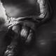 Art nude photograph of a woman lying in dark water with her naked body... (thumbnail)