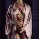 Woman with red ropes of Shibari bondage tied around her sensual naked... (thumbnail)